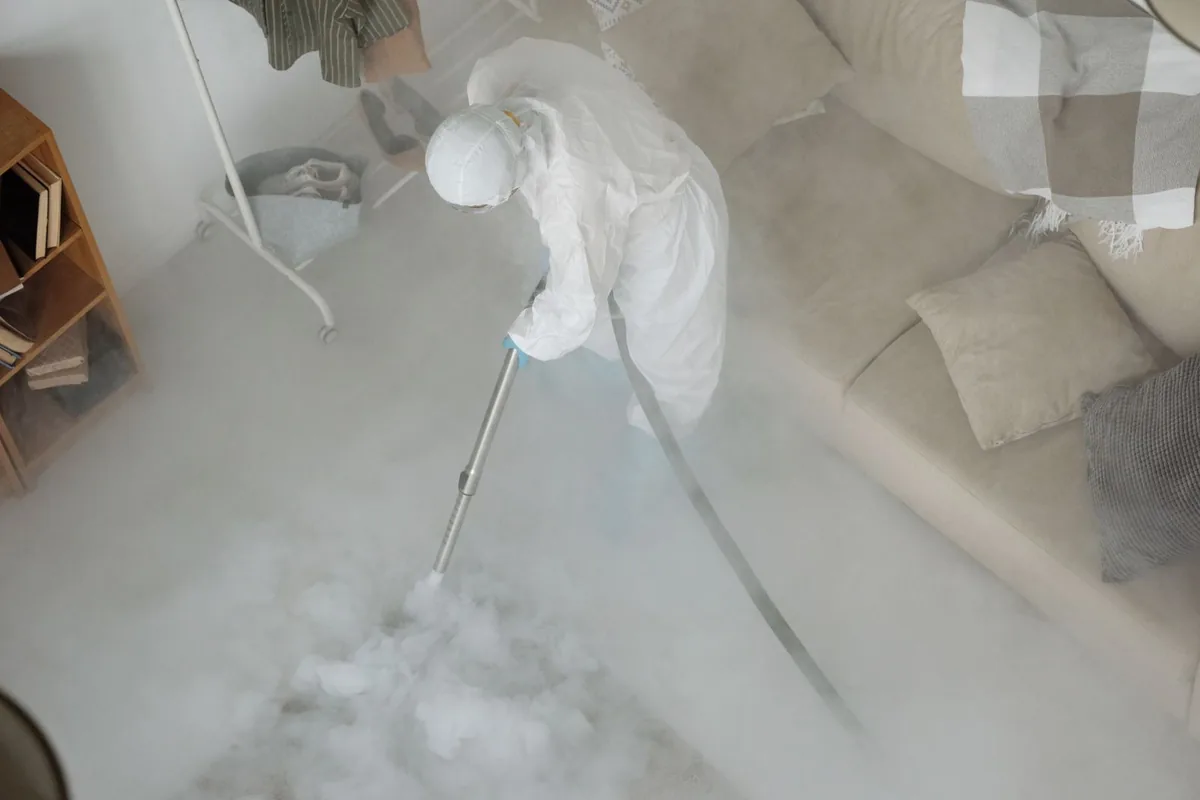 Biohazard cleanup technician in protective equipment, University City, Philadelphia, PA